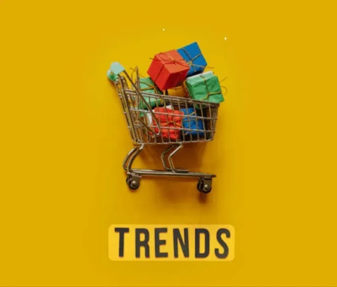Miniature shopping cart filled with colorful gifts